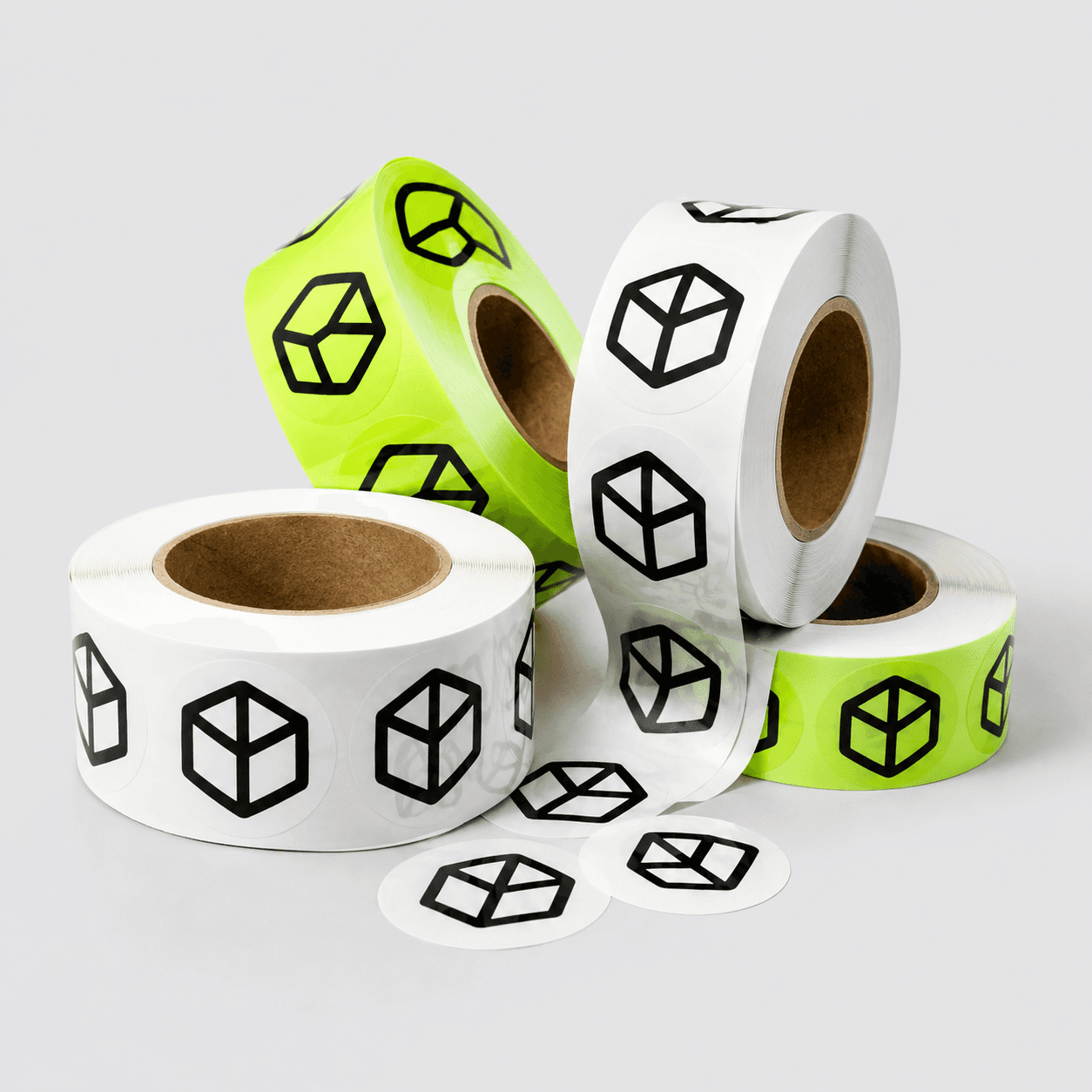 Rolls of white and lime DCL cube-logo stickers